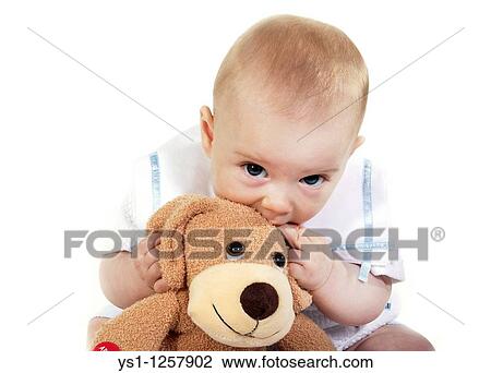 BABY, BOY PLAYING WITH A SOFT TOY View Large Photo Image Stock Image - BABY, BOY PLAYING WITH A SOFT TOY. Fotosearch