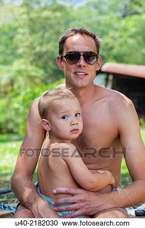 Stock Image - baby boy playing with his father.. Fotosearch