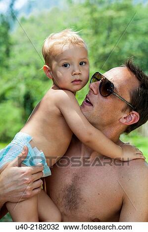 baby boy playing with his father. View Large Photo Image Stock Image - baby boy playing with his father.. Fotosearch