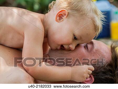 baby boy playing with his father. View Large Photo Image Stock Image - baby boy playing with his father.. Fotosearch