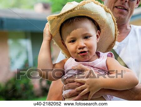 Stock Image - baby boy playing with his father.. Fotosearch
