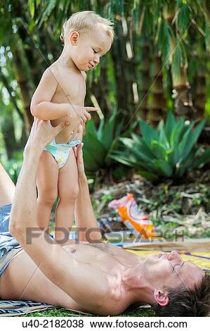 baby boy playing with his father. View Large Photo Image Stock Photo - baby boy playing with his father.. Fotosearch