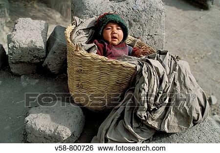 BABY BOY RESTING IN A BASKET, WANLA, LADAKH, INDIA View Large Photo Image Stock Photograph - BABY BOY RESTING IN A BASKET, WANLA, LADAKH, INDIA. Fotosearch