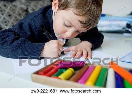 Baby boy three years old drawing whit colored wax crayons, Madrid, Spain View Large Photo Image Stock Photo - Baby boy three years old drawing whit colored wax crayons, Madrid, Spain. Fotosearch