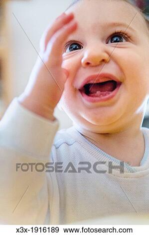 Stock Photo - Baby boy todler with one tooth. Fotosearch