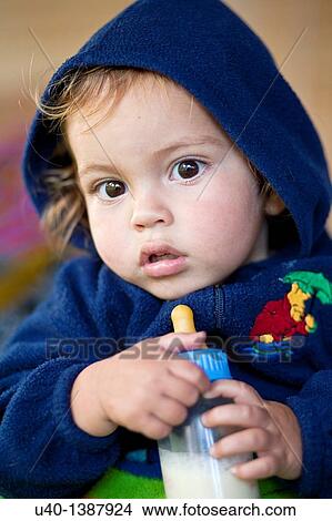 Picture - Baby boy with bottle. Fotosearch
