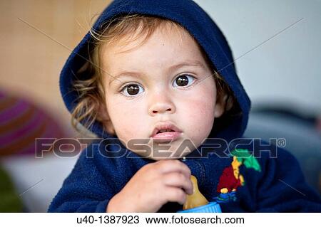 Stock Image - Baby boy with bottle. Fotosearch