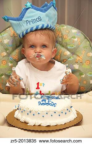 Baby boy with cake and frosting mess making kissy face on his first birthday, Florida, USA. View Large Photo Image Stock Photography - Baby boy with cake and frosting mess making kissy face on his first birthday, Florida, USA.. Fotosearch