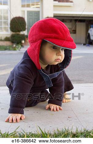 Stock Image - baby crawling outside. Fotosearch