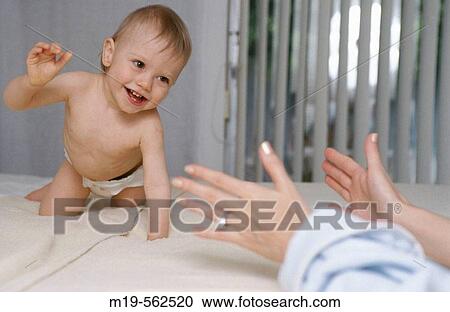 baby crawling to mother View Large Photo Image Stock Image - baby crawling to mother. Fotosearch