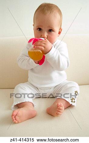 Baby drinking from a baby-cup View Large Photo Image Stock Photography - Baby drinking from a baby-cup. Fotosearch
