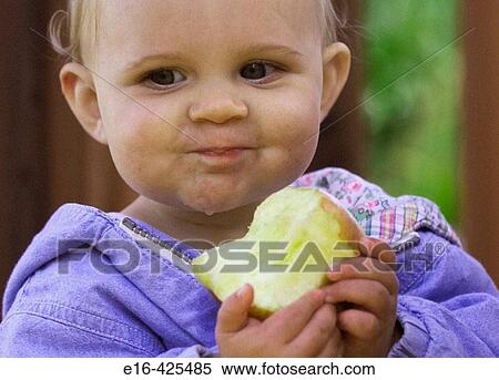baby eating apple View Large Photo Image Stock Photography - baby eating apple. Fotosearch
