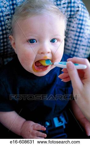Baby eating View Large Photo Image Stock Image - Baby eating. Fotosearch