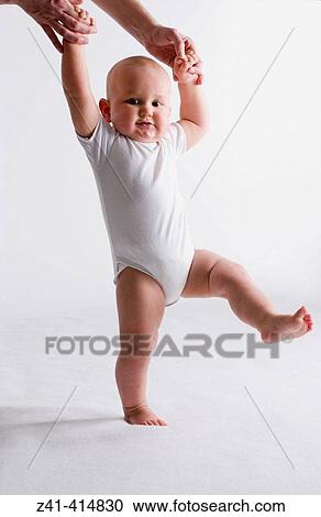 Stock Image - Baby first steps. Fotosearch