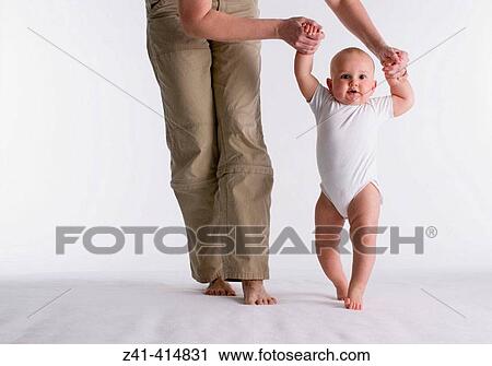 Baby first steps View Large Photo Image Stock Image - Baby first steps. Fotosearch