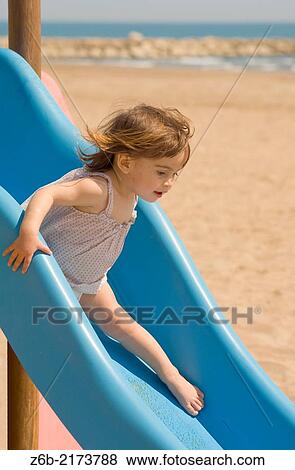 Baby girl, 18/19 months, Beach, Mediterranean sea, Valencia, Spain, Toboggan, Slide, barefoot, sand, wind View Large Photo Image Stock Photo - Baby girl, 18/19 months, Beach, Mediterranean sea, Valencia, Spain, Toboggan, Slide, barefoot, sand, wind. Fotosearch