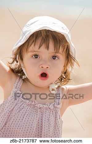 Baby girl, 18/19 months, Outdoors, Sunny, Beach, Mediterranean sea, Valencia, Spain, vacation, Hat View Large Photo Image Stock Photo - Baby girl, 18/19 months, Outdoors, Sunny, Beach, Mediterranean sea, Valencia, Spain, vacation, Hat. Fotosearch