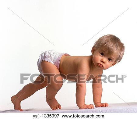 Stock Photo - Baby girl against white background. Fotosearch