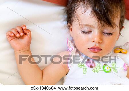 Baby girl asleep View Large Photo Image Picture - Baby girl asleep. Fotosearch
