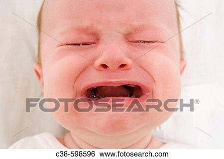 Baby Girl Crying Becuase of Teething View Large Photo Image Stock Photograph - Baby Girl Crying Becuase of Teething. Fotosearch