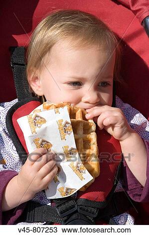 Baby girl eating Belgium waffle, Antwerp. Belgium View Large Photo Image Stock Image - Baby girl eating Belgium waffle, Antwerp. Belgium. Fotosearch