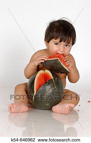 Stock Image - Baby Girl Eating Watermelon. Fotosearch