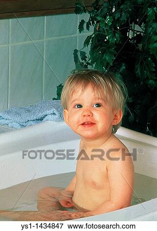 BABY GIRL HAVING A BATH View Large Photo Image Stock Photo - BABY GIRL HAVING A BATH. Fotosearch