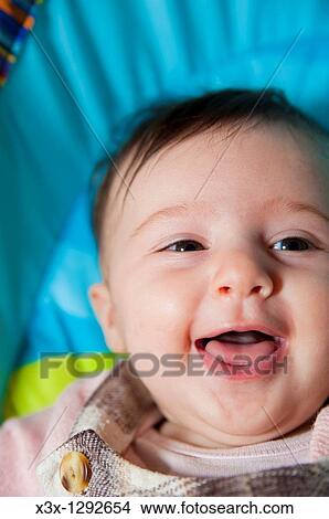 Picture - Baby girl having fun. Fotosearch