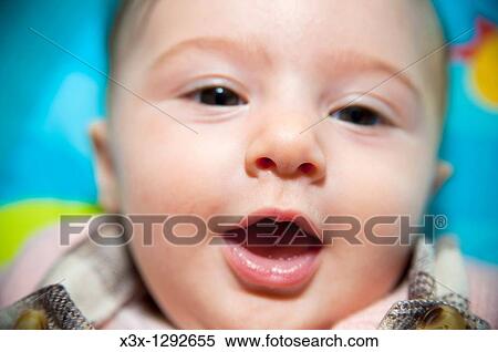 Stock Photography - Baby girl having fun. Fotosearch