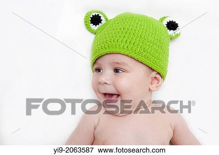 Baby girl in frog hat. View Large Photo Image Stock Photo - Baby girl in frog hat.. Fotosearch