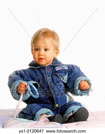 Baby Girl sitting against White Background. View Large Photo Image Stock Photo - Baby Girl sitting against White Background.. Fotosearch