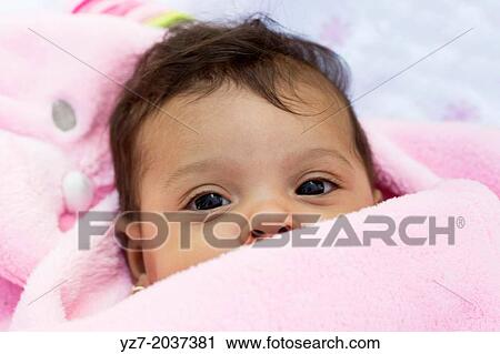 Baby Girl wrapped up in pink blanket in park. View Large Photo Image Stock Image - Baby Girl wrapped up in pink blanket in park.. Fotosearch