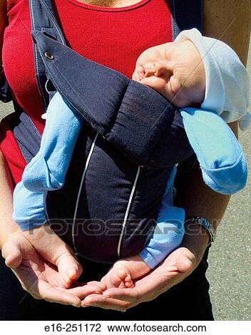 Baby in baby carrier View Large Photo Image Stock Image - Baby in baby carrier. Fotosearch
