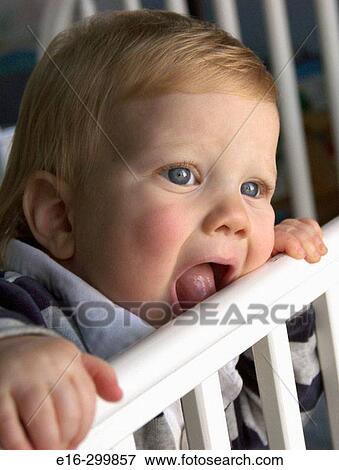 baby in crib View Large Photo Image Stock Photo - baby in crib. Fotosearch