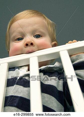 Stock Photography - baby in crib. Fotosearch