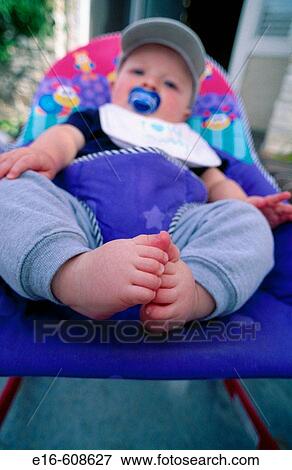 Stock Photo - Baby in seat. Fotosearch