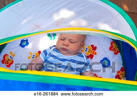 Baby in shade cover View Large Photo Image Picture - Baby in shade cover. Fotosearch