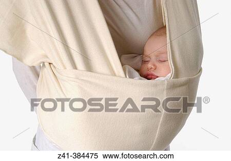 Baby in strap View Large Photo Image Stock Photography - Baby in strap. Fotosearch