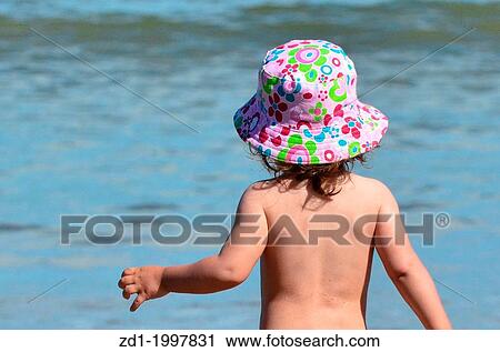 Baby in the sea at sunset. View Large Photo Image Stock Image - Baby in the sea at sunset.. Fotosearch