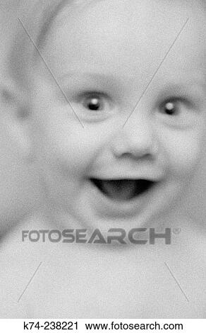 Stock Image - Baby Laughing At Camera. Fotosearch
