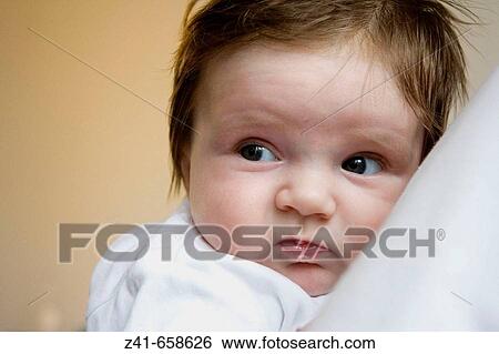 Baby leaning against his mother View Large Photo Image Stock Photograph - Baby leaning against his mother. Fotosearch