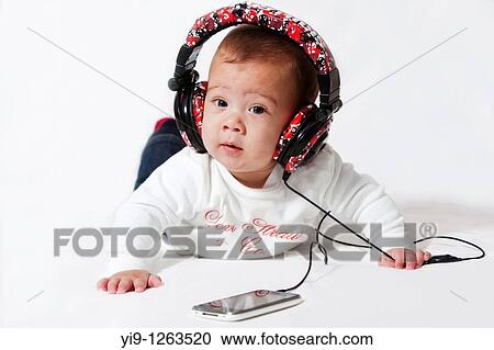 Baby listening to music View Large Photo Image Stock Image - Baby listening to music. Fotosearch