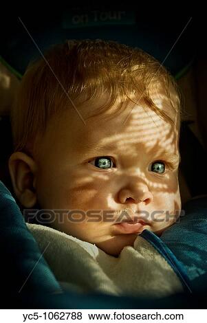 Baby looking at window View Large Photo Image Stock Photo - Baby looking at window. Fotosearch