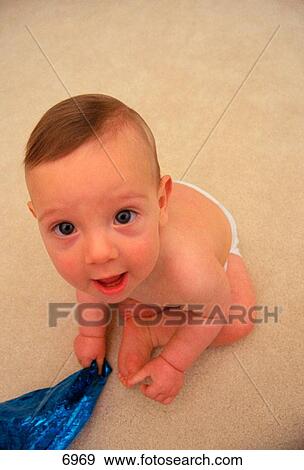 Baby looking upward View Large Photo Image Stock Photo - Baby looking upward. Fotosearch