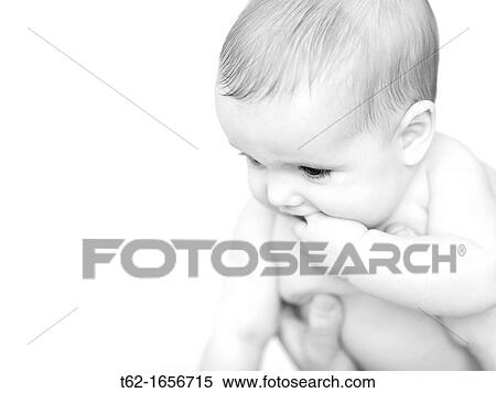Baby looks at the world through the eyes of the first time View Large Photo Image Stock Photography - Baby looks at the world through the eyes of the first time. Fotosearch