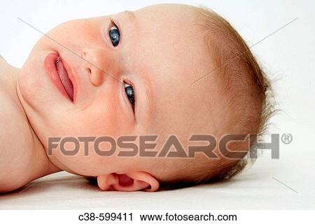 Baby Lying Down Looking at Camera View Large Photo Image Stock Image - Baby Lying Down Looking at Camera. Fotosearch