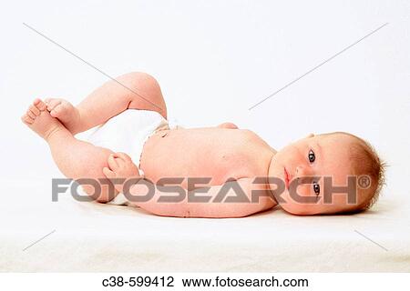 Baby Lying Down Looking at Camera View Large Photo Image Stock Image - Baby Lying Down Looking at Camera. Fotosearch