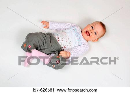 Baby lying on back View Large Photo Image Stock Image - Baby lying on back. Fotosearch