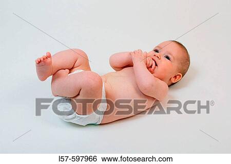 Baby lying on back, studio, Oetwil am See, Zuerich, Switzerland View Large Photo Image Stock Photograph - Baby lying on back, studio, Oetwil am See, Zuerich, Switzerland. Fotosearch