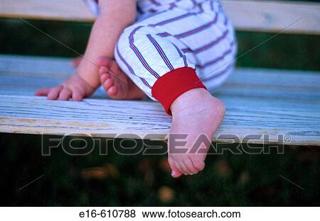 Stock Photo - Baby on bench. Fotosearch